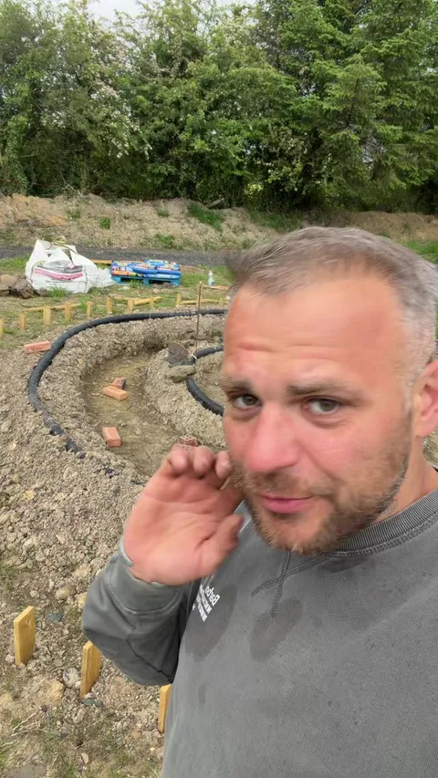 TikTok video cover: a crew member talking to camera on a site with new drainage pipework
